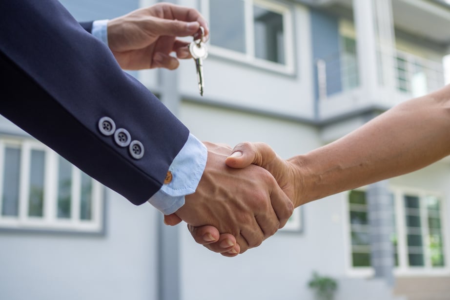 Real Estate Agent Shaking Hands with Client